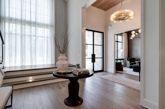 a view of entryway and hall with wooden floor