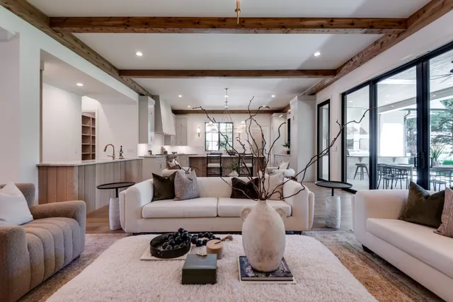 a kitchen with stainless steel appliances granite countertop a kitchen island hardwood floor sink and stove