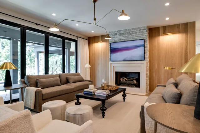 a kitchen with stainless steel appliances granite countertop a sink and a refrigerator