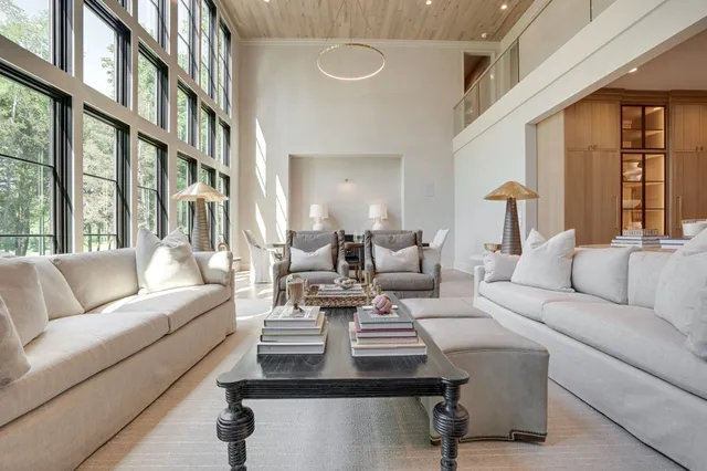a large spacious bathroom with a double vanity sink large mirror and a bathtub