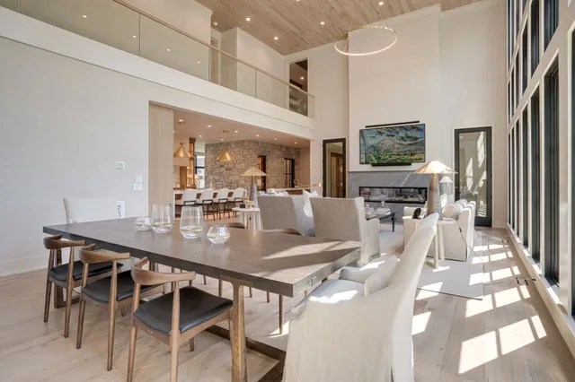 a spacious bedroom with a bed and a chandelier