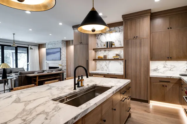 a living room with furniture a flat screen tv and a large window