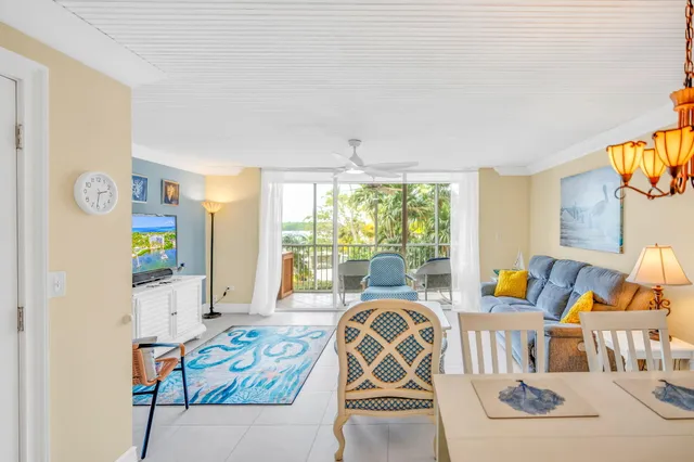 a balcony with furniture and a potted plant