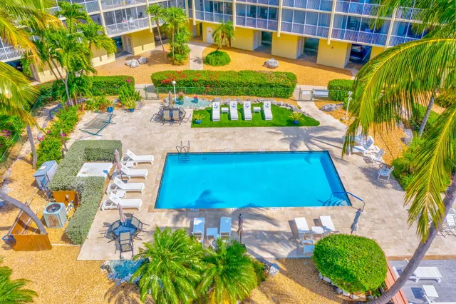 a living room with furniture and a book shelf