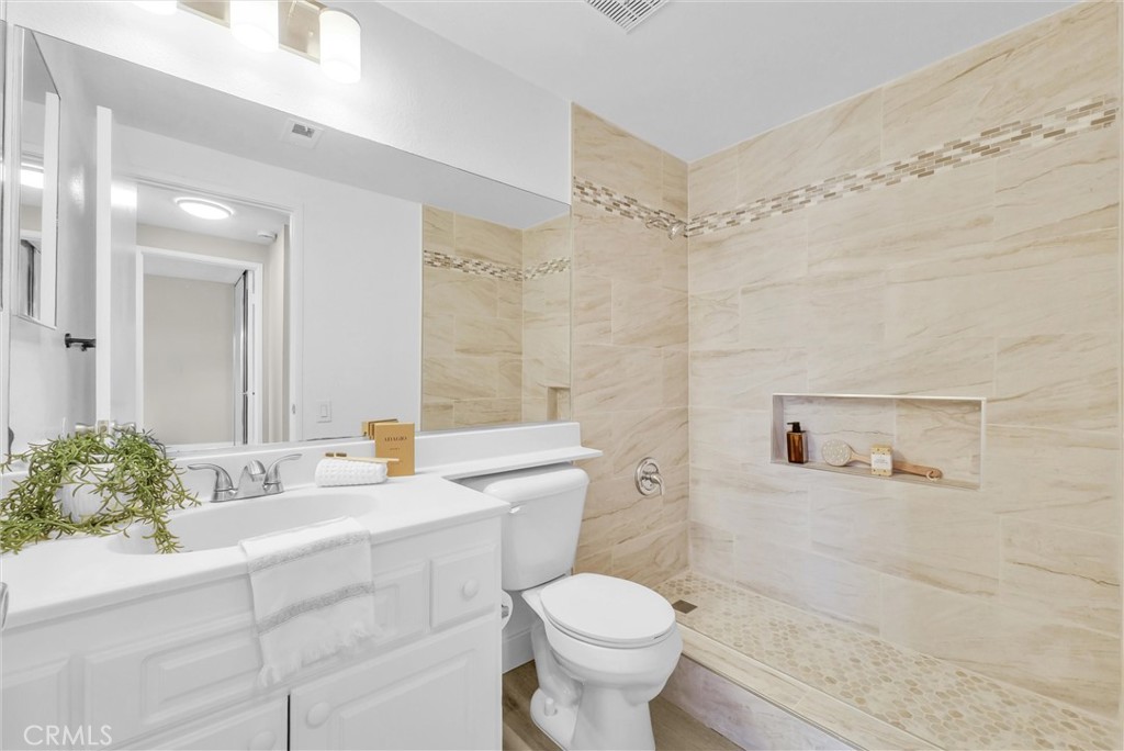 16040 Leffingwell Road, Unit 30 Whittier, CA 90603 - Photo 17 of 25 Remodeled shower with designer tile and updated light fixtures