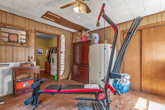 a view of entryway and hall with wooden floor