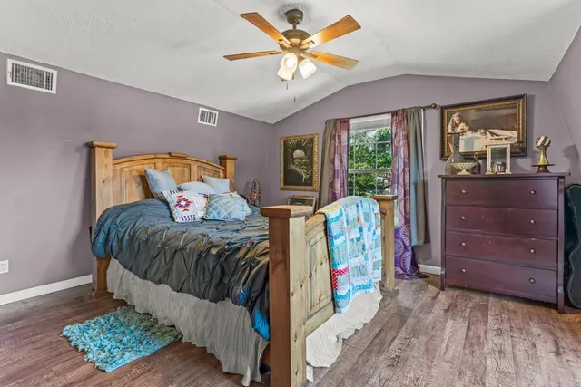 a bedroom with furniture and a window