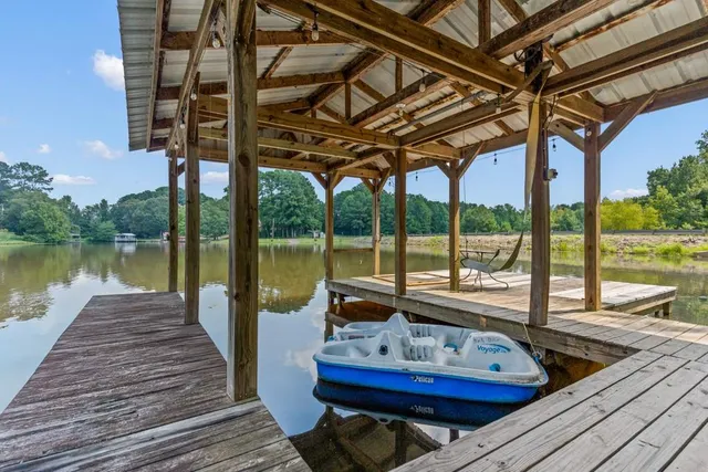 a view of a green yard with lots of trees