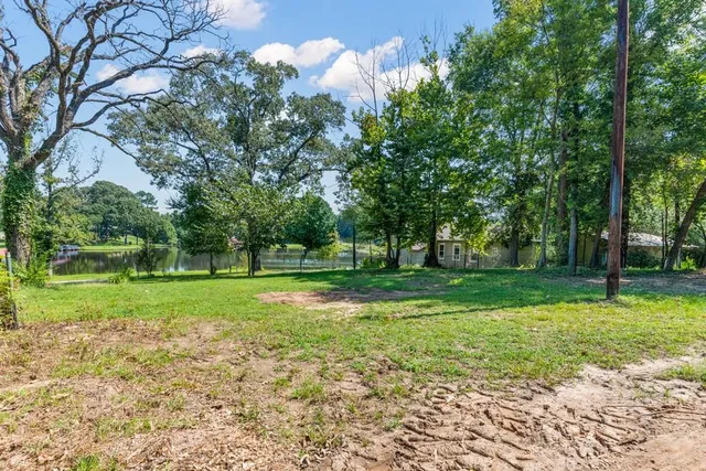 a view of outdoor space with deck and yard