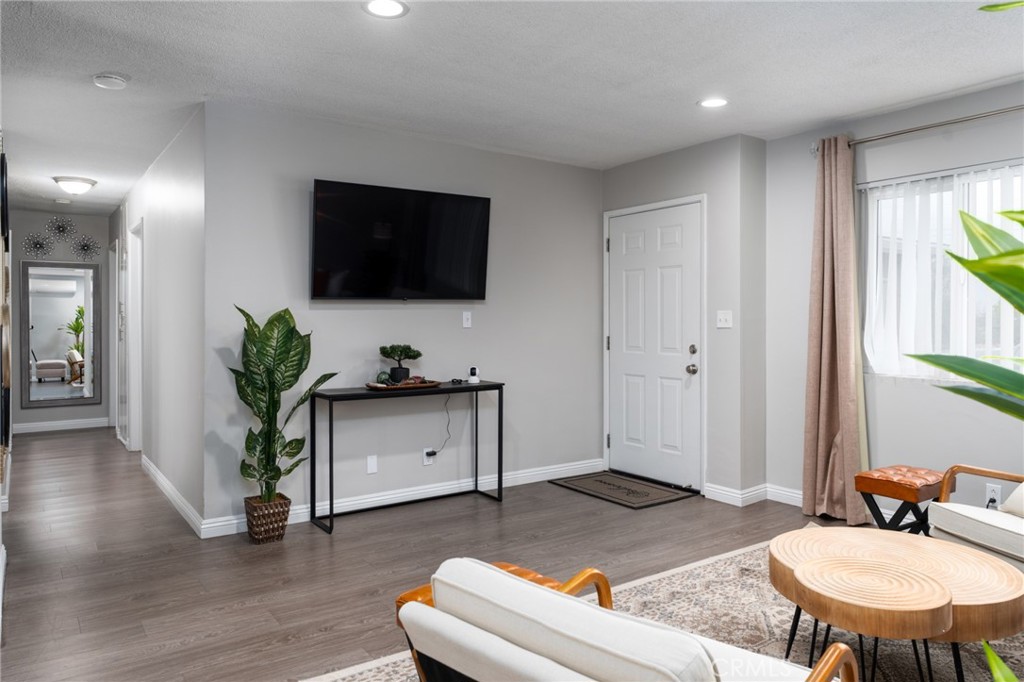 716 Orange Street Riverside, CA 92501 - Photo 3 of 28 a living room with furniture and a flat screen tv