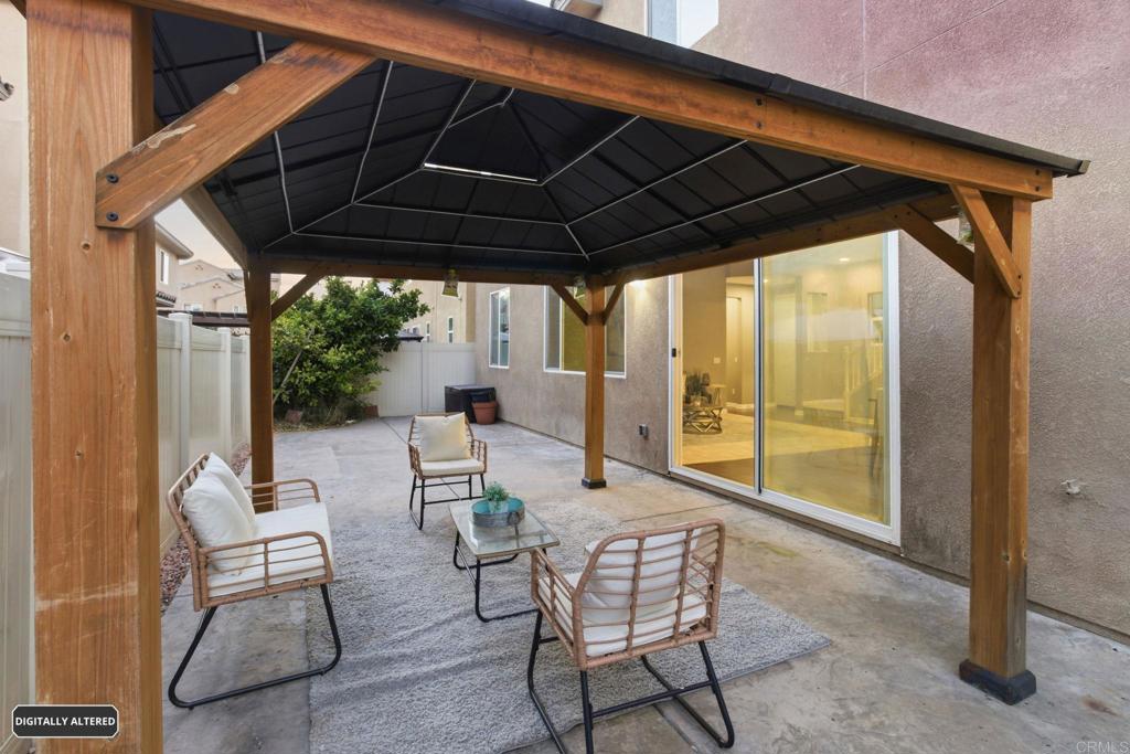 1508 Carpinteria Street Chula Vista, CA 91913 - Photo 34 of 39 a patio with a patio table and chairs
