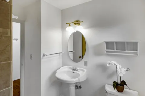 a bathroom with a sink and a mirror