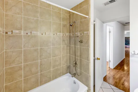 a bathroom with a shower and a sink
