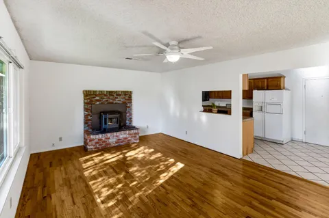a view of livingroom with hardwood floor and a ceiling fan