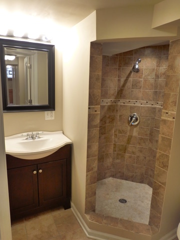6840 West 64th Street Chicago, IL 60638 - Photo 11 of 19 a bathroom with a sink and a mirror