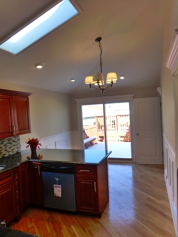6840 West 64th Street Chicago, IL 60638 - Photo 18 of 19 a kitchen with granite countertop stove top oven and cabinets