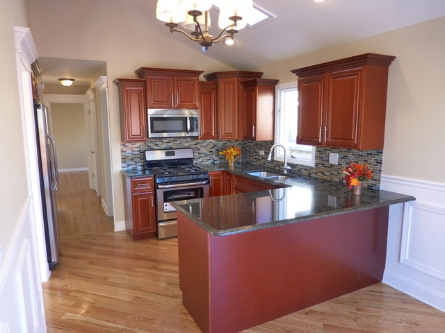 6840 West 64th Street Chicago, IL 60638 - Photo 4 of 19 a kitchen with stainless steel appliances granite countertop a refrigerator a sink dishwasher a stove with wooden cabinets and floor