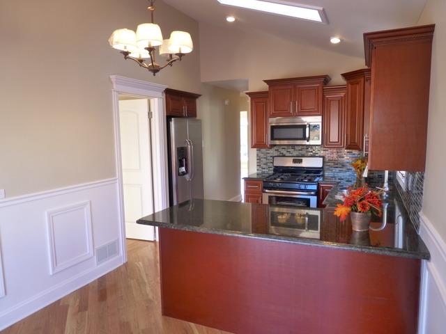 6840 West 64th Street Chicago, IL 60638 - Photo 5 of 19 a kitchen with stainless steel appliances granite countertop a refrigerator a stove top oven a sink and dishwasher
