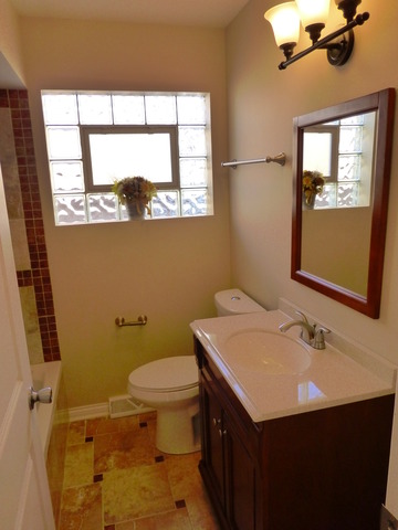 6840 West 64th Street Chicago, IL 60638 - Photo 6 of 19 a bathroom with a sink mirror vanity and toilet