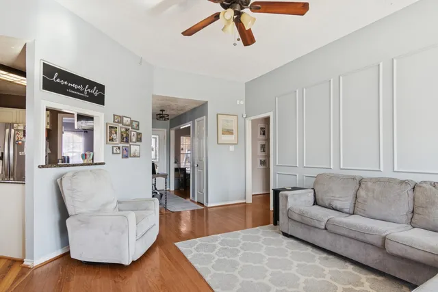 a living room with furniture and a rug