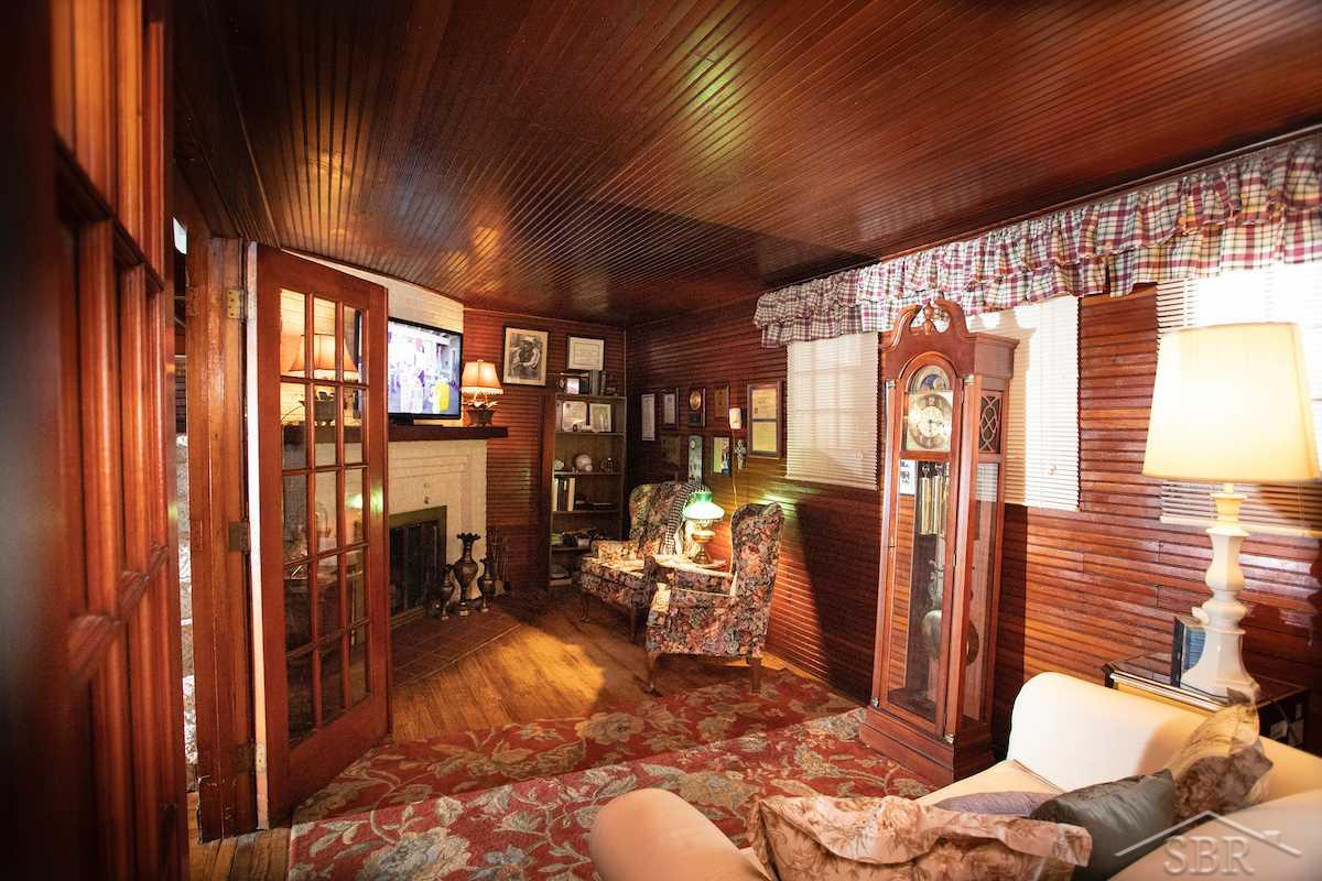 156 North Linwood Beach Road Linwood, MI 48634 - Photo 12 of 81 This charming Den not only offers a gas log fireplace, but plenty of space for a private office.