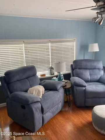 a living room with furniture and a gate