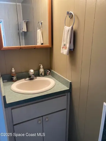 a kitchen with stainless steel appliances granite countertop a stove top oven a sink and a refrigerator