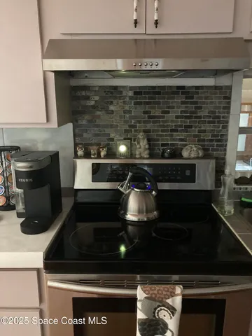 a view of a workspace with furniture