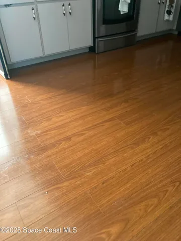 a utility room with sink dryer and washer