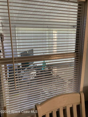 a view of living room kitchen and entryway