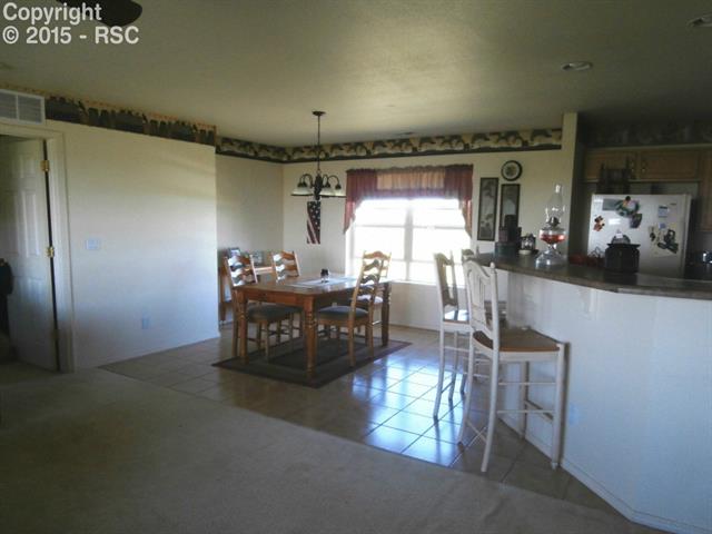 32280 Funk Road Calhan, CO 80808 - Photo 9 of 28 Dining area and breakfast bar