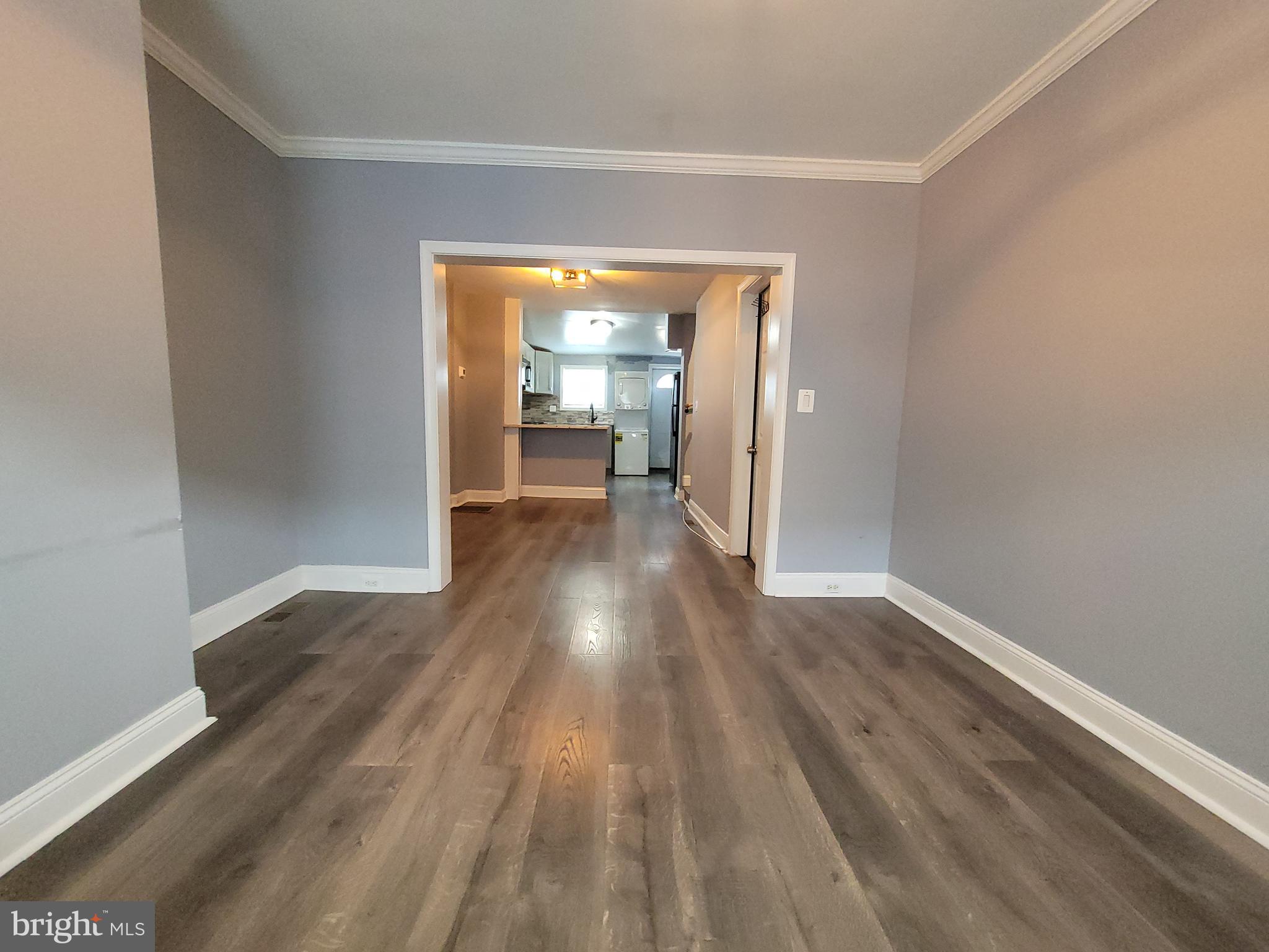 617 Archer Street Baltimore, MD 21230 - Photo 4 of 12 a view of a hallway with wooden floor