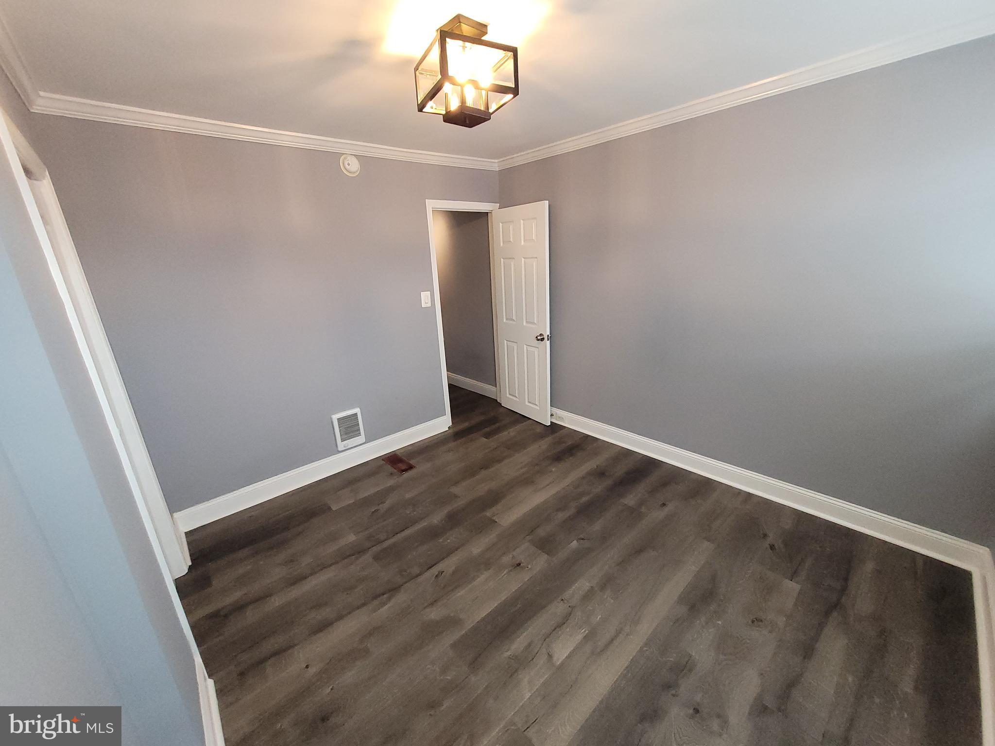 617 Archer Street Baltimore, MD 21230 - Photo 10 of 12 an empty room with a wooden door