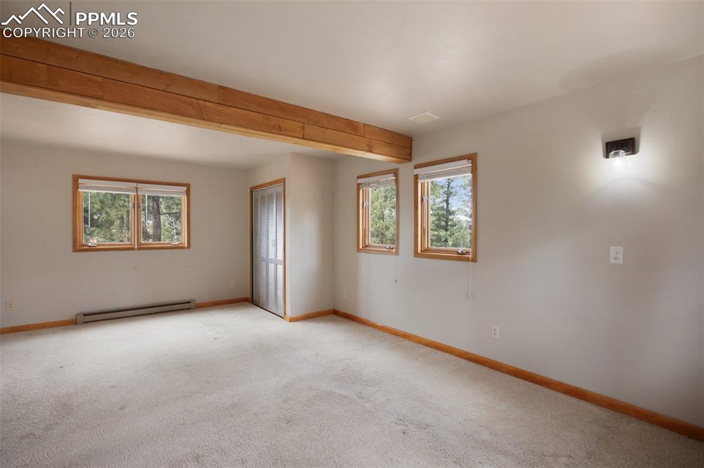 2061 Spruce Road Woodland Park, CO 80863 - Photo 14 of 26 a view of an empty room with a window