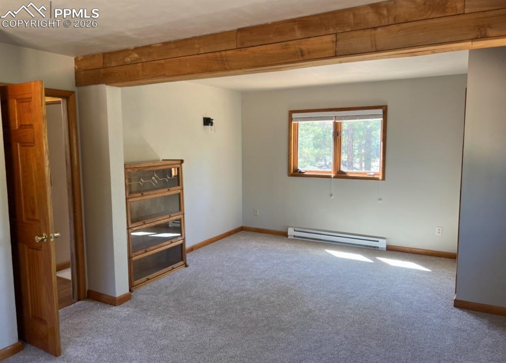 2061 Spruce Road Woodland Park, CO 80863 - Photo 21 of 26 a view of an empty room with a window