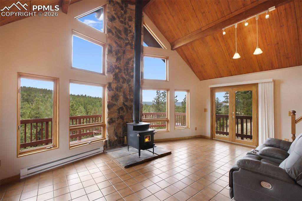 2061 Spruce Road Woodland Park, CO 80863 - Photo 7 of 26 a living room with furniture and large windows