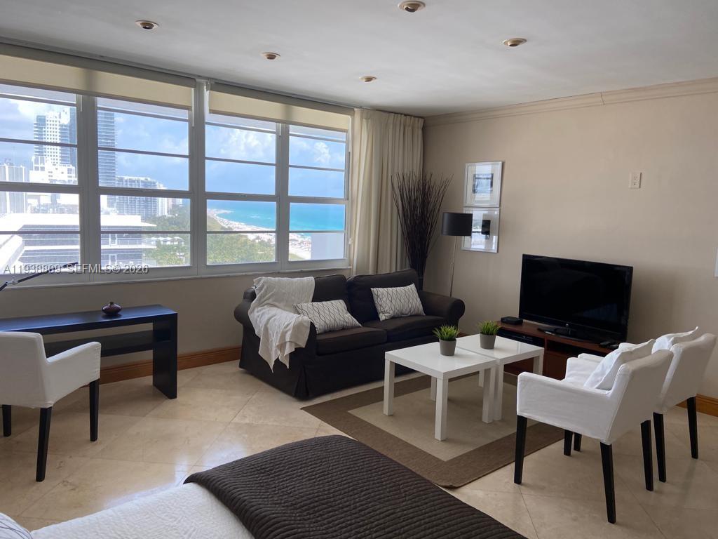 100 Lincoln Road, Unit 1631 Miami Beach, FL 33139 - Photo 3 of 30 a living room with furniture and a flat screen tv