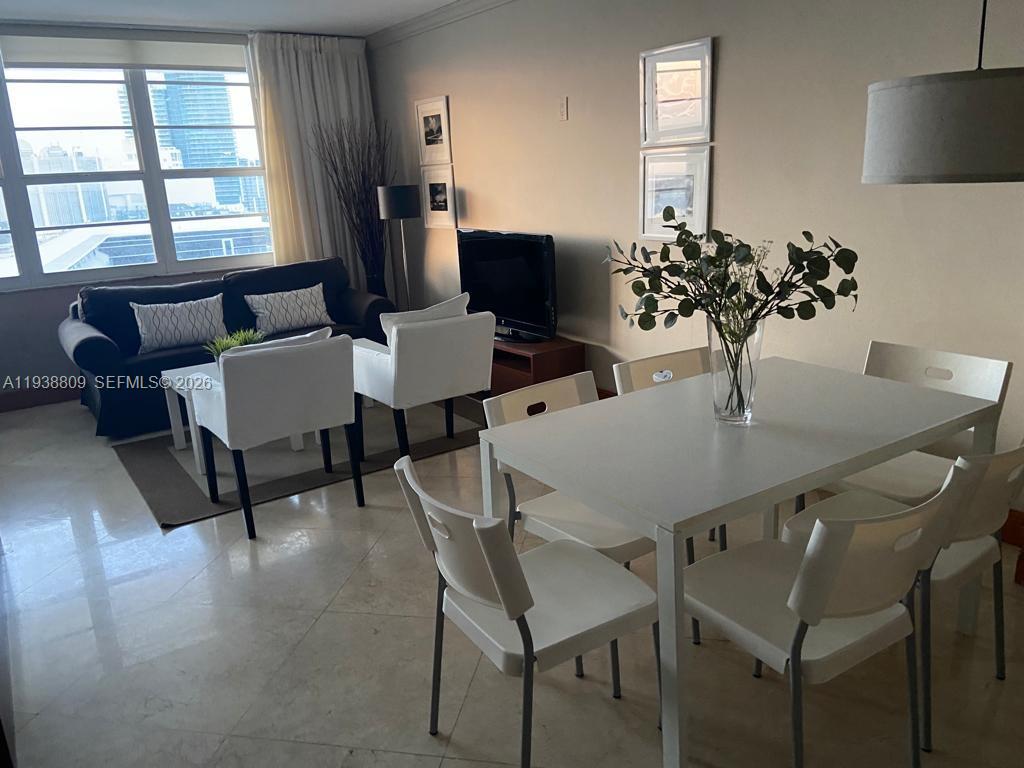 100 Lincoln Road, Unit 1631 Miami Beach, FL 33139 - Photo 5 of 30 a view of a dining room with furniture and window