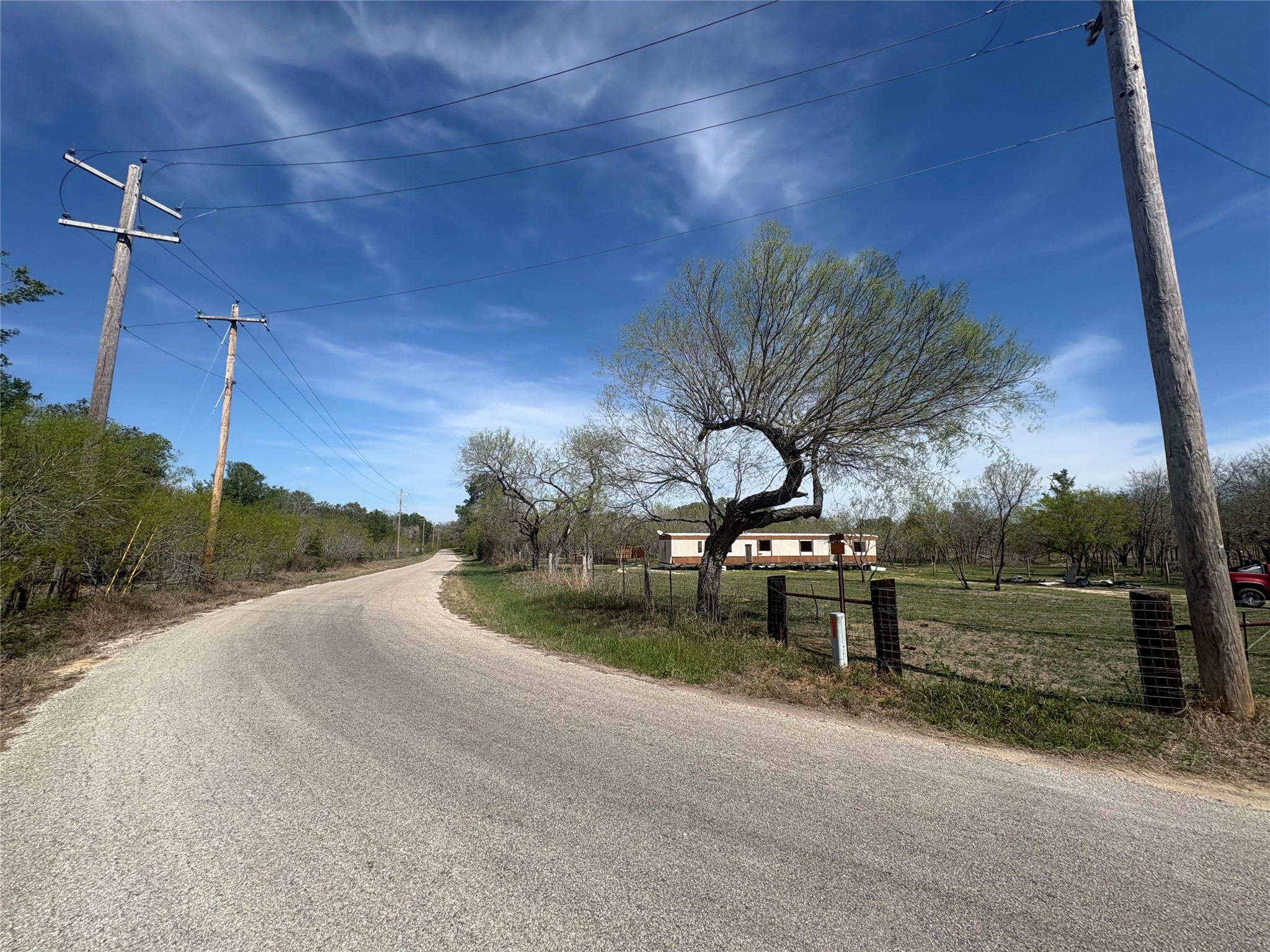 1285 Burdette Wells Road Lockhart, TX 78644 - Photo 1 of 32 View of asphalt road