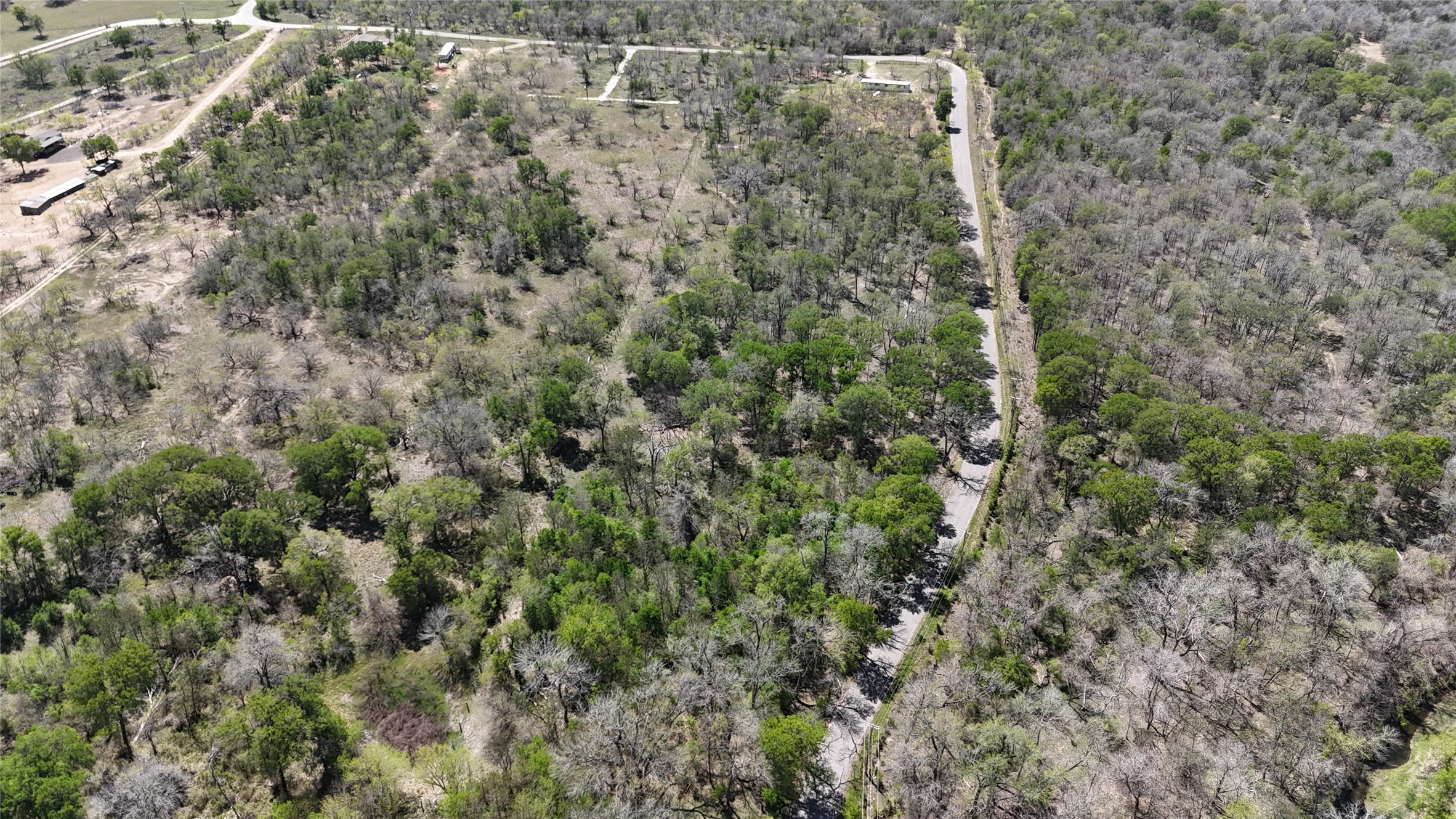 1285 Burdette Wells Road Lockhart, TX 78644 - Photo 26 of 32 Bird's eye view of a heavily wooded area