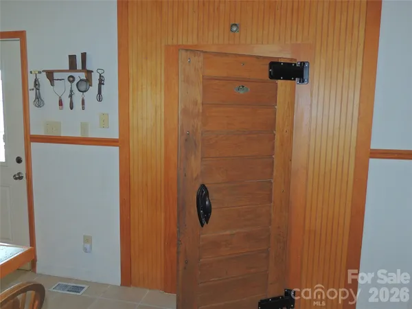 a bathroom with a shower and a sink