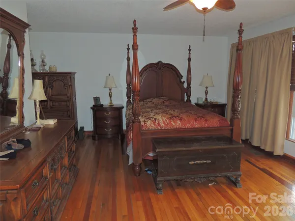 a bed room with a bed and a television