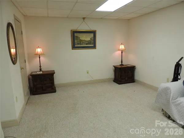 a bed room with furniture and a lamp