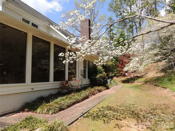 a view of a pathway along the house