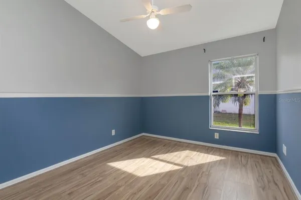 a view of a backyard with a swimming pool