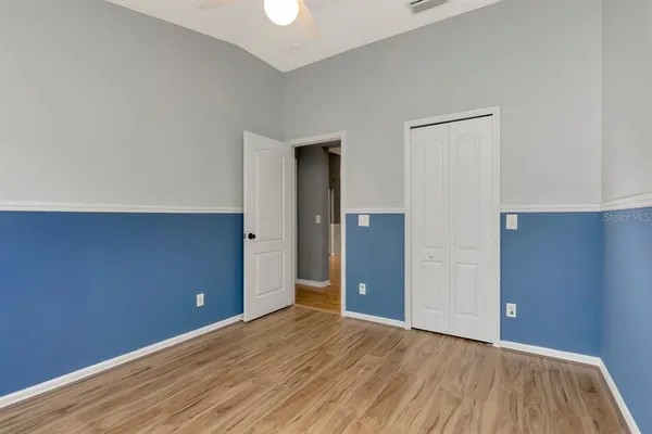 a view of a lake with a palm trees