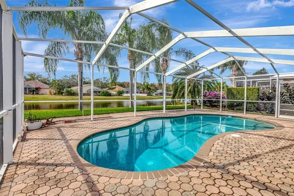 an aerial view of a house with a lake view