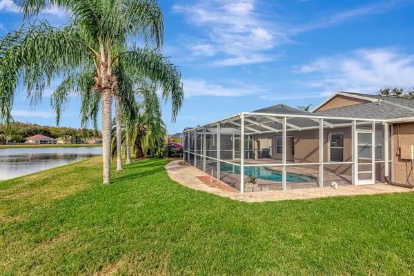 an aerial view of a house with a swimming pool yard and outdoor seating
