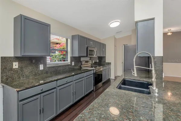 an aerial view of a house with a swimming pool yard and outdoor seating