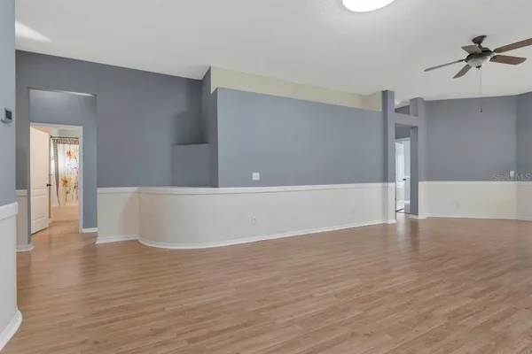 a kitchen with stainless steel appliances granite countertop a refrigerator a stove and a sink